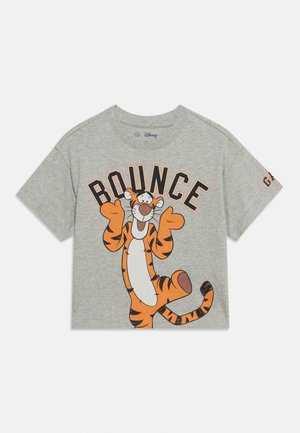 Light gray short-sleeve shirt with smiling cartoon tiger standing on one leg and word "BOUNCE" in bold letters above.