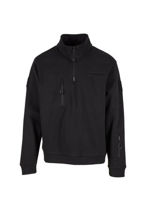 Fekete pulóver kapucnis felső félig cipzárral, magas nyakkal, elülső zsebbe és oldalsó cipzáras zsebbe. Texturált anyaggal és bordás mandzsettával rendelkezik.