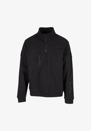 Black pullover sweatshirt with half zipper, high collar, front pocket, and side zip pocket. Features textured fabric and ribbed cuffs.