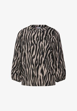 Svart och krämfärgad zebra-randig tröja med rund halsringning och lösa ärmar, tillverkad av ett mjukt tyg med en texturerad yta.