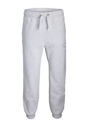 Pantalon de survêtement gris clair avec taille et poignets élastiqués, cordon à l'avant et petit logo discret sur la partie supérieure de la cuisse.