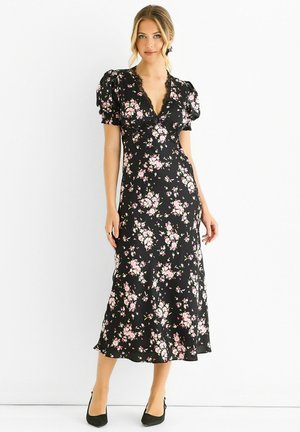 Floral midi dress in black with pink flowers. Puff sleeves and V-neck design with lace trim. Smooth fabric with a flowing silhouette.
