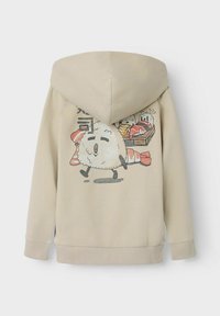 Felpa beige con una grande grafica sul retro che raffigura personaggi di sushi in stile cartone animato. Tessuto morbido con cappuccio regolabile e polsini a costine.