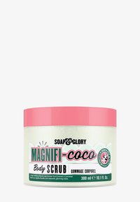 Magnifi-Coco kroppsskrubb i en 300 ml gjennomsiktig krukke. Inneholder et rosa lokk, grønn teekstrakt, kokosnøtt og jojobaperler for eksfoliering av huden.