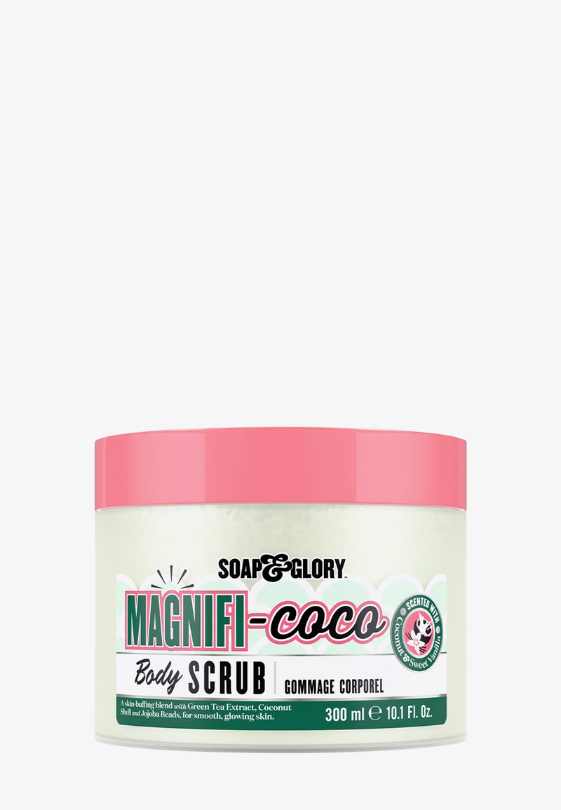 Magnifi-Coco kroppsskrubb i en 300 ml gjennomsiktig krukke. Inneholder et rosa lokk, grønn teekstrakt, kokosnøtt og jojobaperler for eksfoliering av huden.