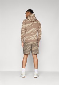 Venum UFC FIGHT WEEK TRAINING SHORTS - Spordišortsid - desert