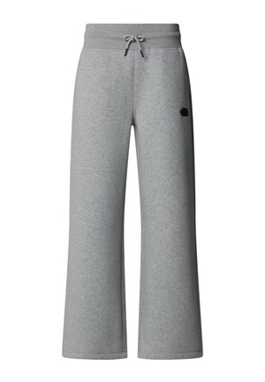 Grijze, wijde sweatpants gemaakt van zachte stof. Heeft een elastische tailleband met een trekkoord en een klein logo aan de zijkant.