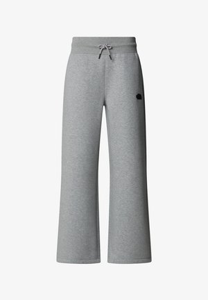 Graue, weit geschnittene Sweatpants aus weichem Stoff. Mit elastischem Bund und Kordelzug sowie einem kleinen Logo an der Seite.