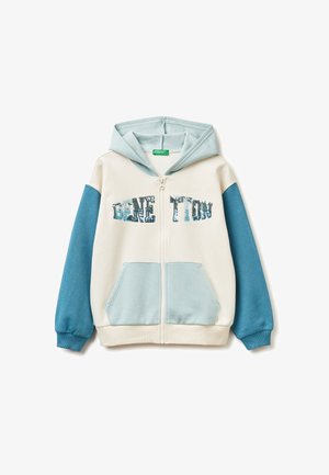 Sudadera con capucha y cremallera en crema y azul, con un gráfico texturizado de "GENE TION". Incluye dos bolsillos frontales y puños acanalados.