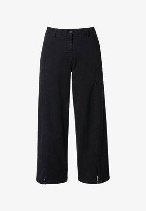 Mustat leveälahkeiset farkut, joissa on napin sulkeminen, vyölenkit ja sivurosoja hemme design-yksityiskohtana.