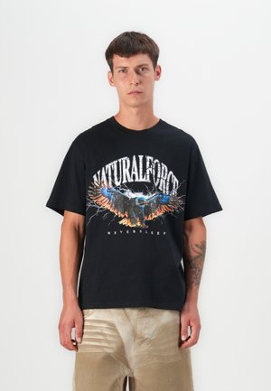 Black cotton t-shirt featuring a graphic design of an eagle with orange and blue accents, text "NATURALFORCE" above and "NEVERSLEEP" below.