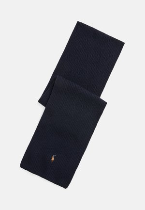 Sciarpa di maglia blu navy realizzata in tessuto testurizzato, con un piccolo logo ricamato in oro. Forma rettangolare semplice, senza ulteriori motivi.