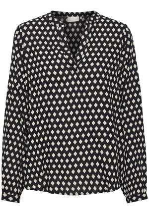 Sort langærmet bluse med v-udskæring og hvide abstrakte prikker. Blødt stof med løs pasform og knaplukninger på ærmerne.