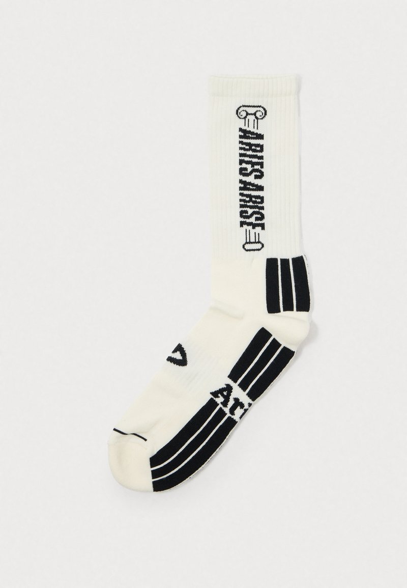 White crew sock with black graphic designs, including "ARTISAN" text, and three black stripes at the ankle. Ribbed texture.