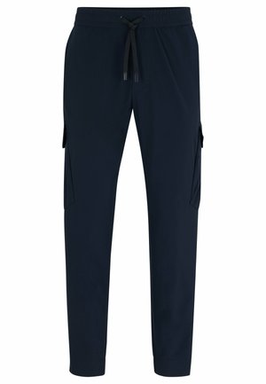 Navy jogging pants with a drawstring waistband, tapered legs, and two side cargo pockets. Smooth texture and casual design.