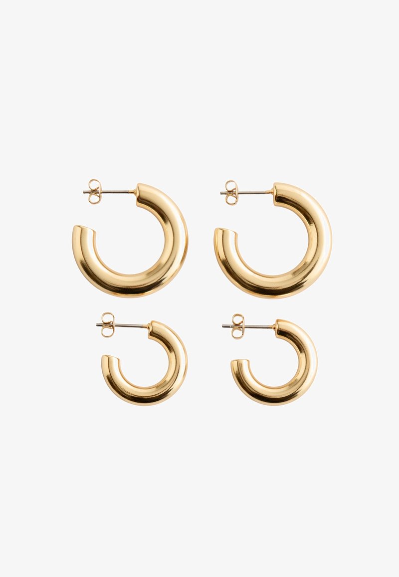 Auksinės spalvos auskarai, su lygiu, blizgiu paviršiumi. Dvi dydžių parinktys: dideli ir maži, su apvalia, atvira mėnulio forma.