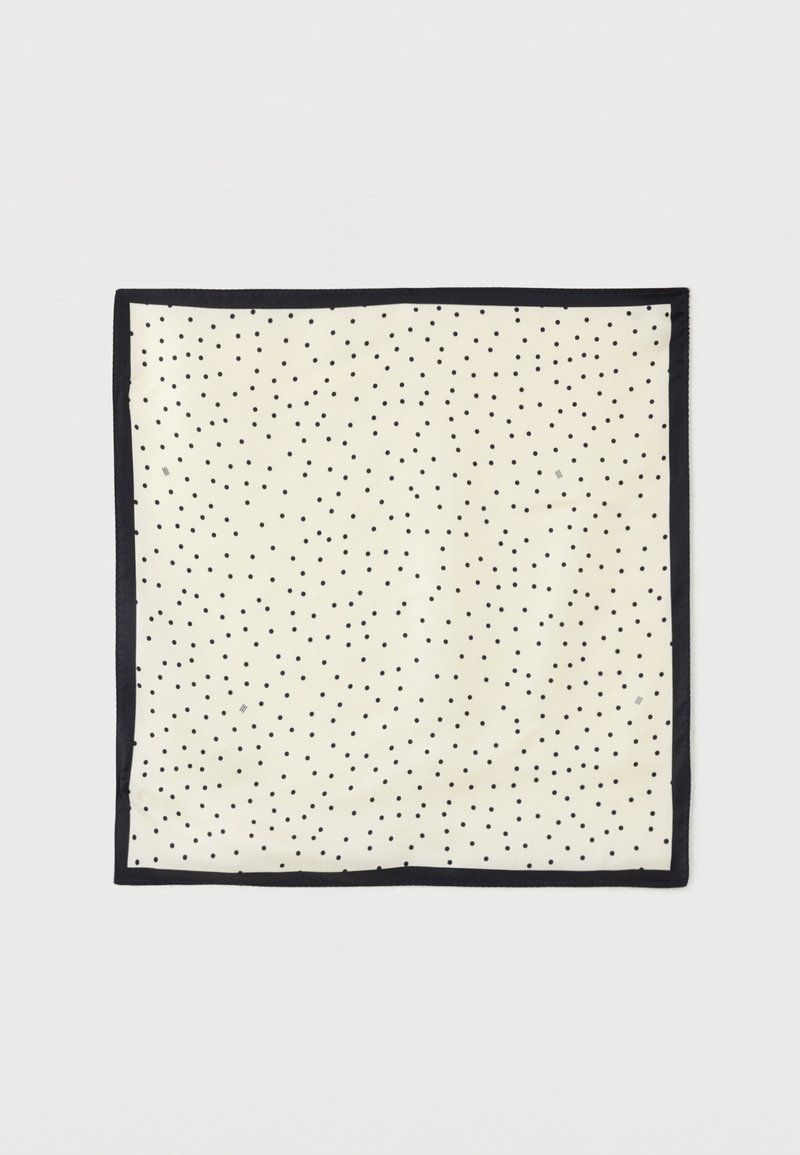 Τετράγωνο ύφασμα κρεμ με μικρές μαύρες πουά ομοιόμορφα τοποθετημένες και ένα σταθερό μαύρο περίγραμμα.