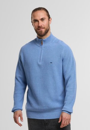 Light blue zip-up sweater made of textured knit fabric. Features ribbed cuffs and hem, and a small logo accent on the chest.