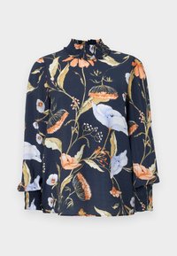 Navy floral blouse with ruffled collar, featuring colorful flower patterns in orange, white, and blue. Three-quarter sleeves with elastic cuffs.
