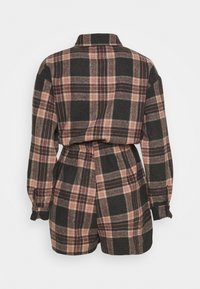 Plaid romper, dark gray with pink and beige checks, collar, long sleeves, cinched waist, textured fabric, back view shown.