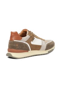 Suede and leather sneakers feature a contrasting tan and beige color scheme with a textured upper, textured midsole, and lace closure.