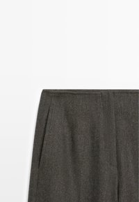 Dark gray trousers made of textured fabric featuring pleats at the waist and a clean, tailored design. No visible hardware or patterns.