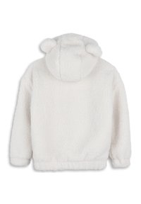 Bílá fleecová bunda s kapucí, která má dvě zaoblená ouška, měkký materiál, žebrované manžety a lem, navržená pro teplo a pohodlí.