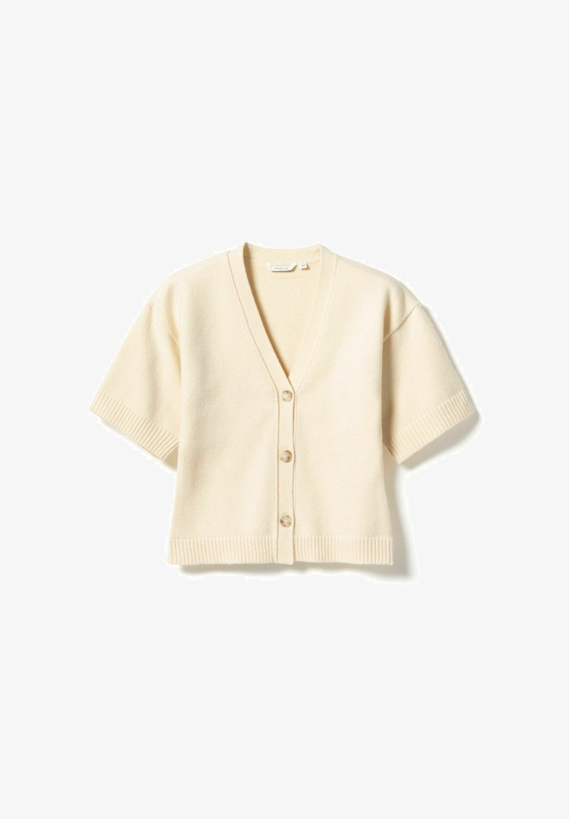 Crèmekleurig kortermig vestje met een V-hals, vijf knopen en geribbelde rand aan mouwen en zoom. Gemaakt van zacht materiaal met een gladde textuur.