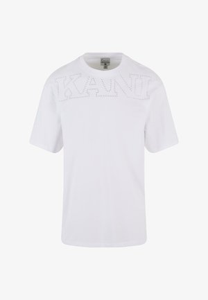 Biała bawełniana koszulka z krótkim rękawem i okrągłym dekoltem. Na przodzie znajduje się napis "KANI" z ozdobnymi ćwiekami.