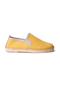 Scarpa slip-on gialla in tela con suola in juta naturale, caratterizzata da accenti beige attorno all'apertura e cuciture lungo il bordo.