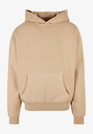 Beige bomuldshoodie med en frontlomme, hætte med snøre og ribbede manchetter og kant. Blød tekstur, afslappet pasform og uden mønstre.