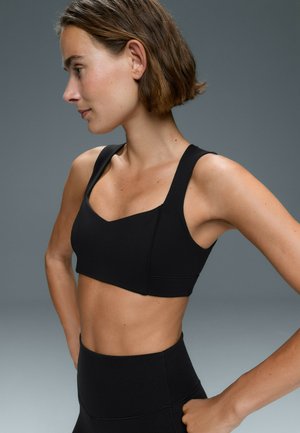 OYSHO, MEDIUM-SUPPORT OPEN-BACK EVERMOVE SPORTS BRA - Sport-BH - black