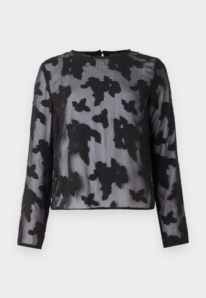 Sort gennemsigtig bluse med lange ærmer, med et blomstermønster lavet af tekstureret stof-applikation, rund halsudskæring og en nøglehul-detail bagpå.