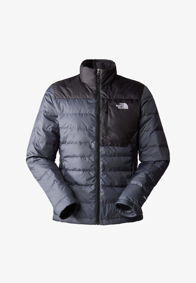 Veste matelassée gris foncé avec des accents noirs. Comprend un col montant, une fermeture éclair, une texture matelassée et un logo sur la poitrine.