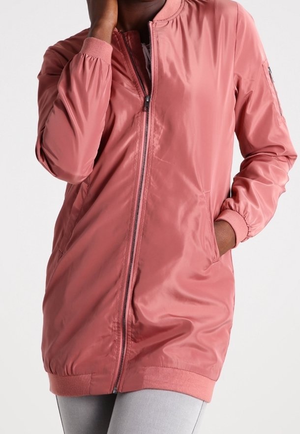 Light pink, zip-up bomber jacket with a round collar, elastic cuffs, and side pockets. Smooth, shiny fabric with a relaxed fit.