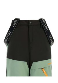 Pantaloni da sci neri e verde menta con bretelle regolabili, tasche con cerniera e design frontale piatto. Dettaglio notevole con cerniera arancione.