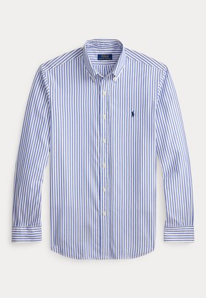 White shirt with blue horizontal stripes, long sleeves, button-down collar, and a small embroidered logo on the chest. Soft cotton material.