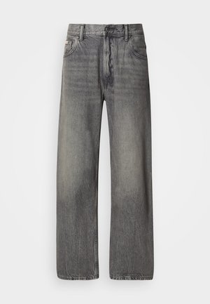 Weit geschnittene Jeans aus dunkelgrauem Denim mit ausgewaschenem Finish. Verfügt über klassisches Fünf-Taschen-Design und Gürtelschlaufen.