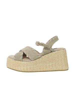 Sandali wedge beige con base in juta intrecciata, caratterizzati da un design a fascia incrociata e una cintura alla caviglia regolabile. Texture in morbido suede.