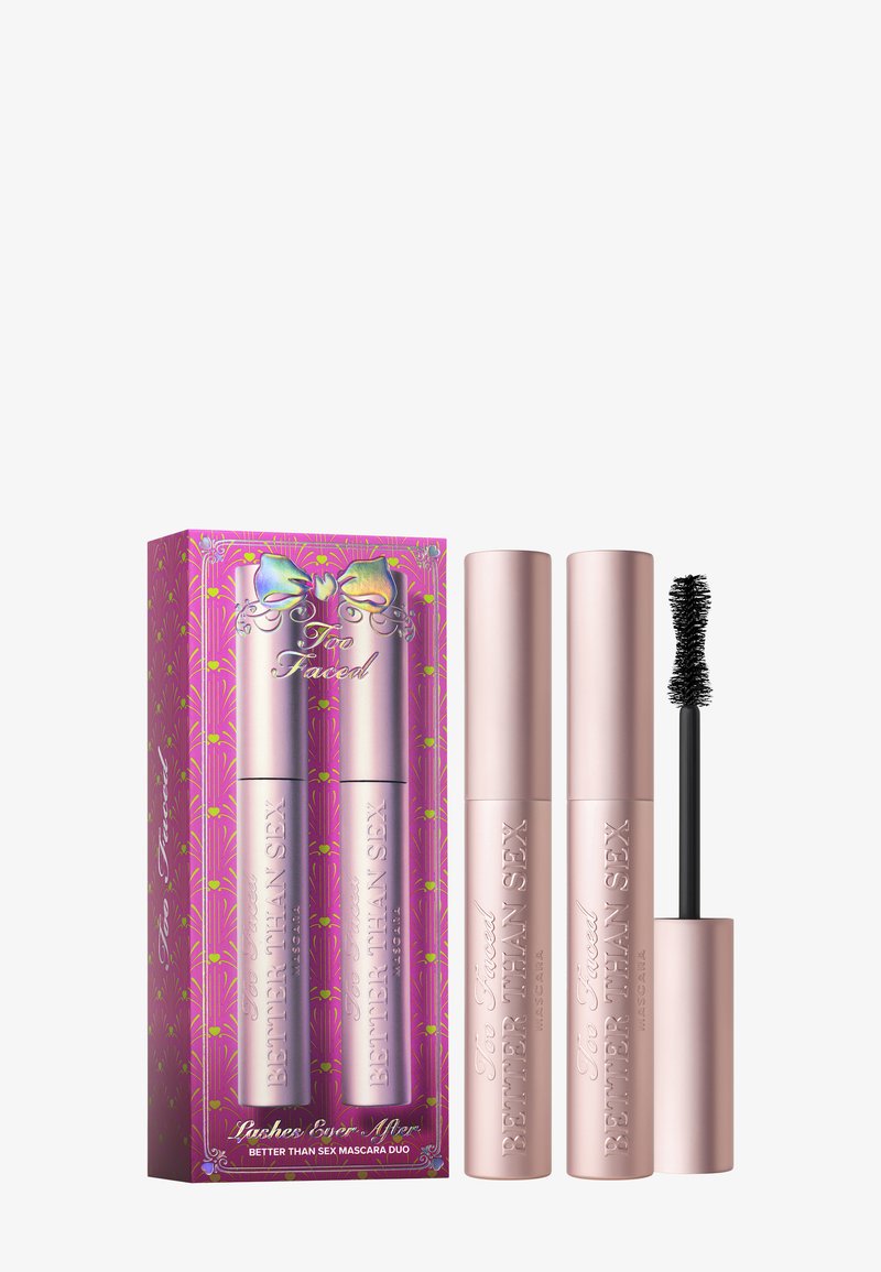 Duo mascara set with pink metallic tubes and black bristle wand. Box features vibrant colors and floral patterns with a ribbon detail.