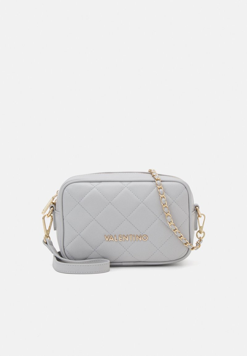 Gray quilted handbag with gold hardware, featuring a chain strap and embossed brand logo on the front. Rectangular shape, smooth texture.