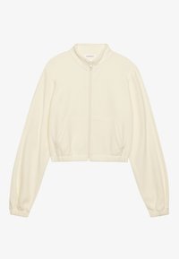Cropped zip-up jacket in cream, made of soft fabric. Features long sleeves, two front pockets, and elastic cuffs for a fitted look.