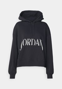 Sudadera negra con capucha y un bolsillo canguro en la parte frontal. Presenta un gran gráfico plateado de "JORDAN" en el pecho. Ajuste casual y holgado.