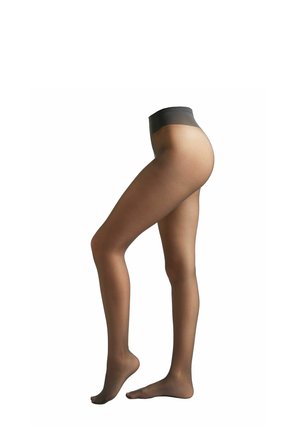 Female legs wearing sheer brown pantyhose with a dark waistband, one foot flat and the other slightly raised on toes.