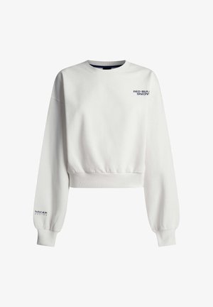 Valge lühendatud dressipluus tumesiniste "Red Bull Racing" logodega rinnal ja vasakul varrukal, varustatud soonikuga mansettide ja äärega.