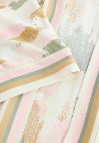 Lightweight fabric featuring a pastel abstract pattern with gold accents. Striped edges in pink, green, and beige; soft texture.