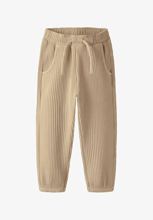 Šviesiai rudos spalvos trikotažinės laisvalaikio kelnės su elastine juosmens juosta, reguliuojama raišteliu ir šoninėmis kišenėmis. Minkšta tekstūra su siaurėjančiomis kojomis.