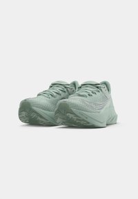Light green running shoes with a textured mesh upper, lace-up design, and patterned rubber outsole for enhanced grip.