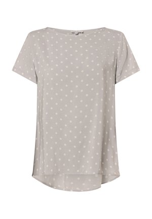 Blouse gris clair à manches courtes avec des pois blancs et un col arrondi, légèrement plus longue à l'arrière.
