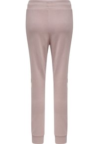 Lyse mauve joggingbukser med elastisk taljebånd og ribkant ved anklerne, vist bagfra med diskrete stribedetaljer i siden.